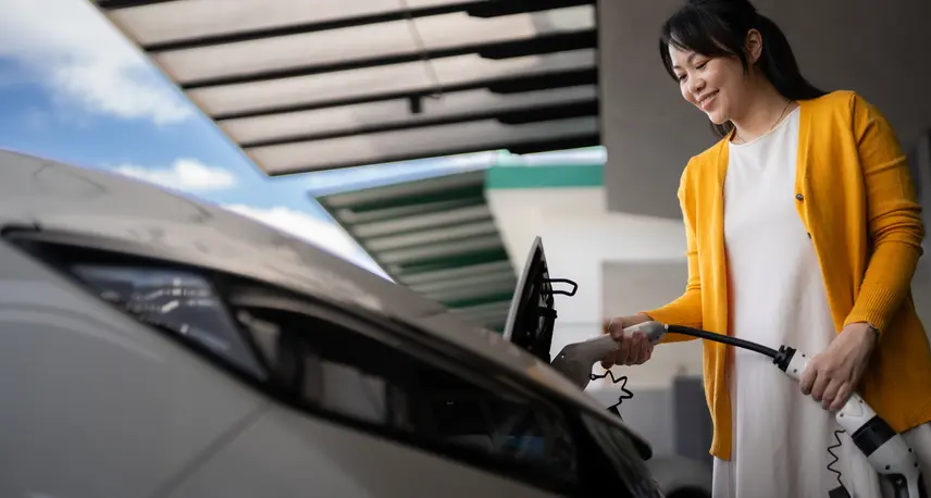 Woman Charging Grey EV.jpg